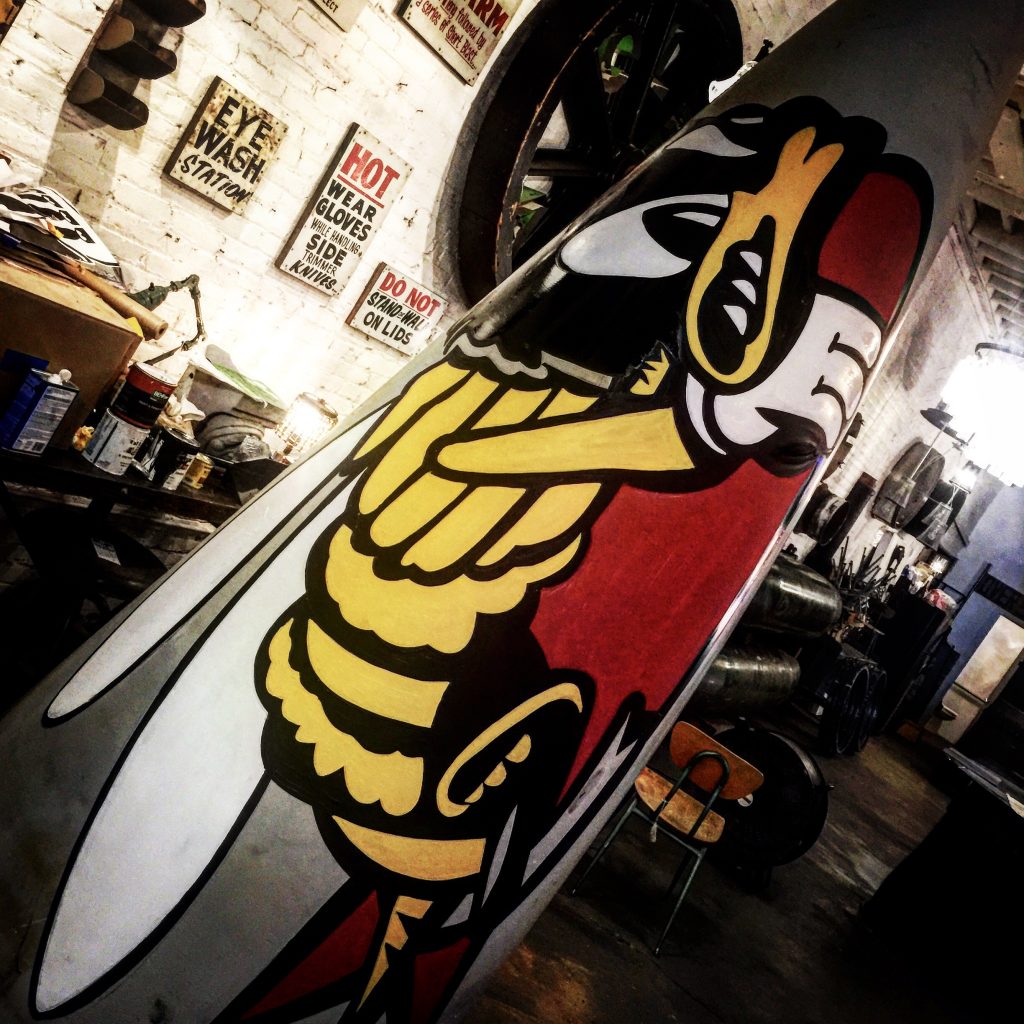 DCLA FAB upcycled F16 nose cone art installation with restored substrate and custom graphics